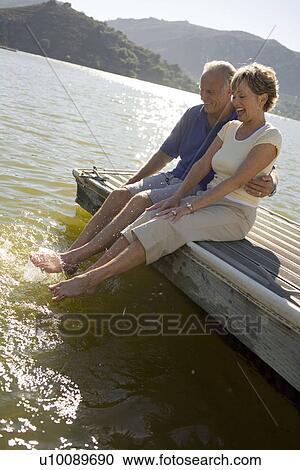 Mature couple by lake View Large Photo Image Stock Image - Mature couple by lake. Fotosearch