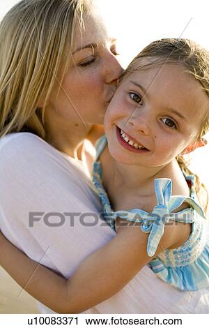 Mother and daughter on beach View Large Photo Image Stock Image - Mother and daughter on beach. Fotosearch