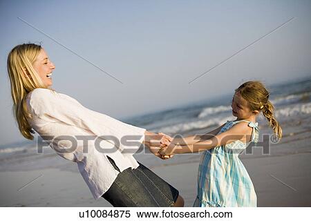 Mother and daughter on beach View Large Photo Image Stock Photography - Mother and daughter on beach. Fotosearch
