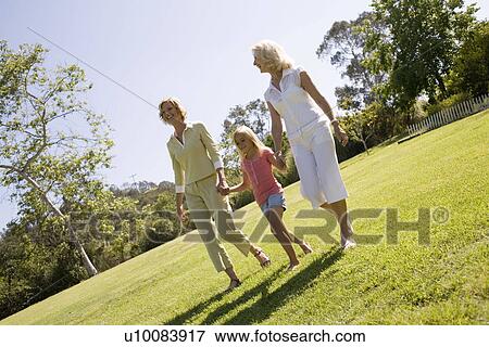 Mother daughter and granddaughter in park View Large Photo Image Stock Photo - Mother daughter and granddaughter in park. Fotosearch