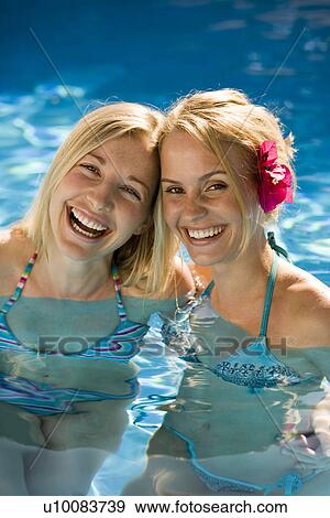 Stock Photo - Two women in pool. Fotosearch