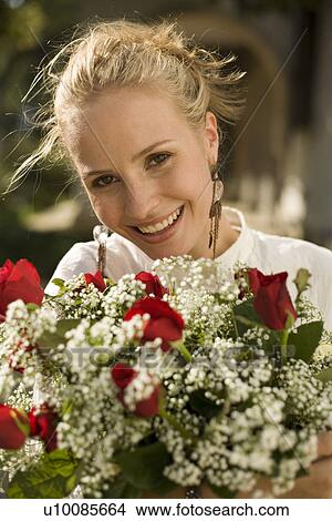 Picture - Woman with flowers. Fotosearch