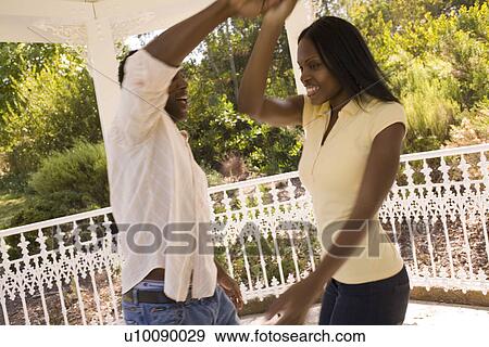 Stock Photo - Young couple dancing. Fotosearch