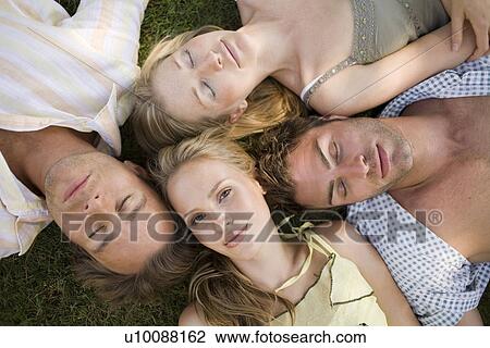 Young couples in park View Large Photo Image Stock Image - Young couples in park. Fotosearch