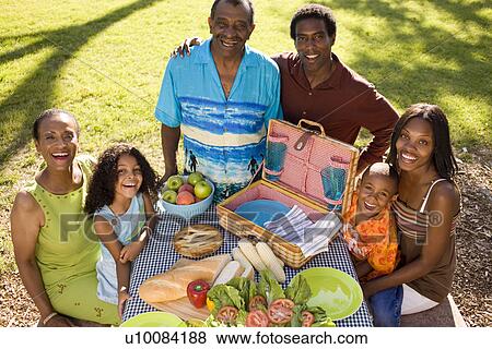 Stock Photo - Family and grandparents in park. Fotosearch