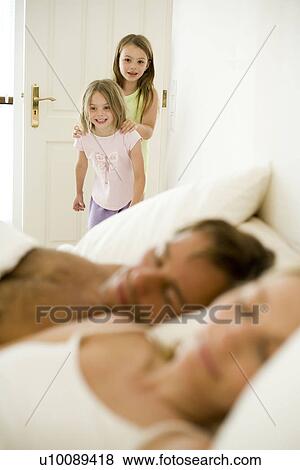 Family at home parents in bed View Large Photo Image Stock Photo - Family at home parents in bed. Fotosearch