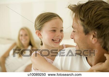Stock Image - Family at home. Fotosearch