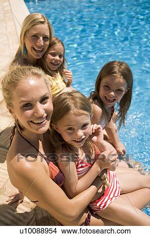 Family by pool View Large Photo Image Picture - Family by pool. Fotosearch