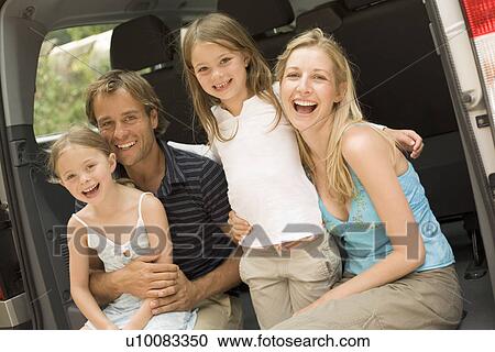 Family getting into car View Large Photo Image Stock Image - Family getting into car. Fotosearch