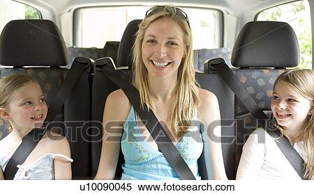 Stock Photography - Family in car. Fotosearch