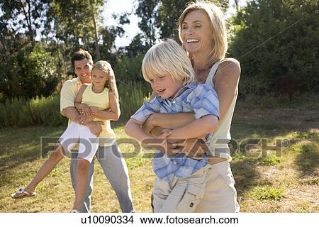 Picture - Family in park. Fotosearch