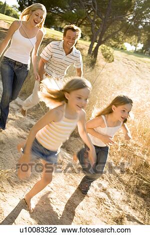 Stock Image - Family in Park. Fotosearch