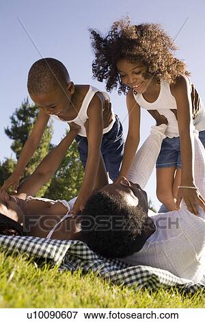 Stock Photo - Family in park. Fotosearch