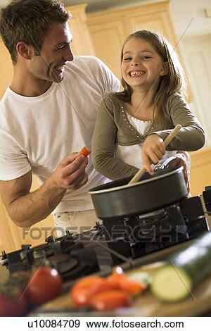 Stock Photo - Father and daughter at home. Fotosearch