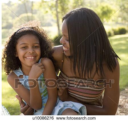 Mother and daughter in park View Large Photo Image Stock Photograph - Mother and daughter in park. Fotosearch