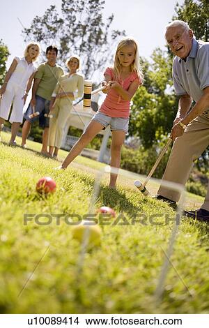 Three Generations in park playing croquet View Large Photo Image Picture - Three Generations in park playing croquet. Fotosearch