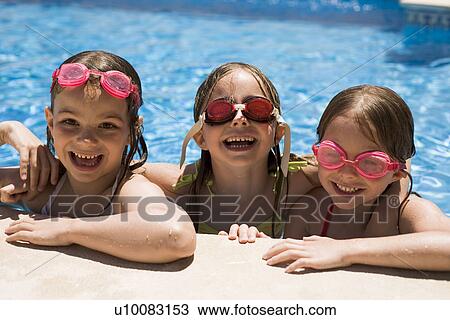 Three girls playing in pool View Large Photo Image Stock Image - Three girls playing in pool. Fotosearch