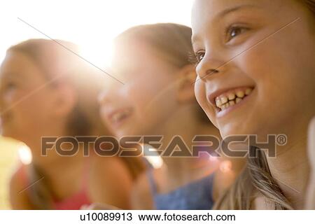 Stock Image - Young girls in park. Fotosearch