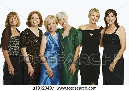 Portrait of a group of mature women standing together and smiling View Large Photo Image Stock Photo - Portrait of a group of mature women standing together and smiling. Fotosearch