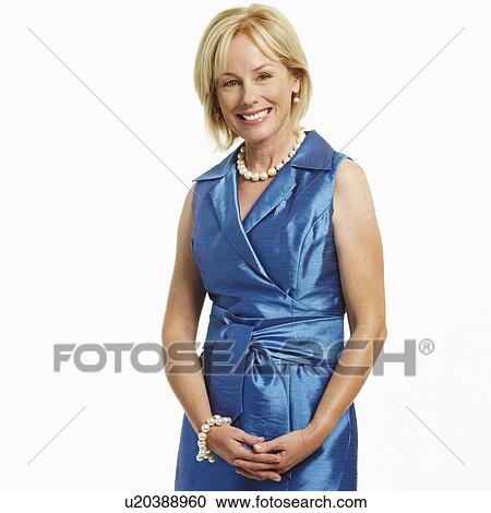 Stock Image - Portrait of a mature woman standing. Fotosearch