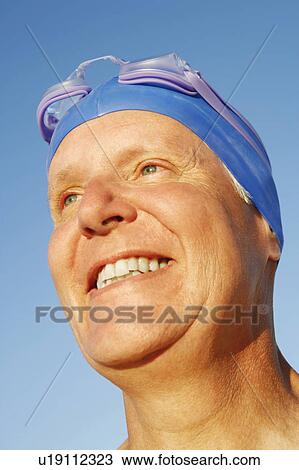 Stock Image - Close-up of a mature man smiling. Fotosearch