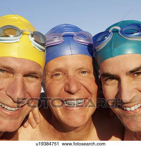 Stock Image - Portrait of three mature men smiling. Fotosearch