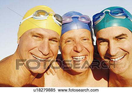 Stock Photography - Portrait of three mature men smiling. Fotosearch
