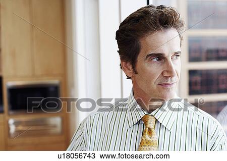 Stock Image - Close-up of a businessman looking sideways. Fotosearch