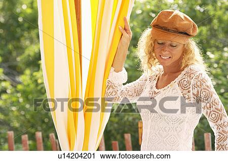 Stock Image - Close-up of a mature woman smiling. Fotosearch