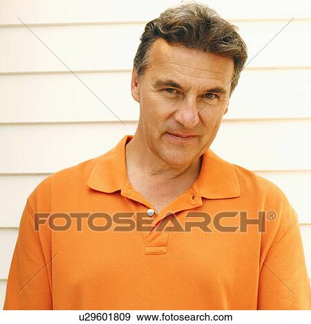 Stock Photo - Portrait of a mature man smirking. Fotosearch