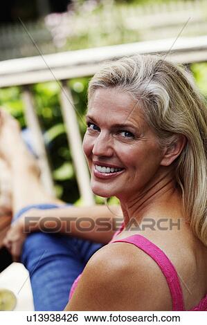 Stock Photograph - Portrait of a mature woman smiling. Fotosearch