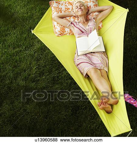 High angle view of a senior woman lying in a hammock View Large Photo Image Stock Photo - High angle view of a senior woman lying in a hammock. Fotosearch