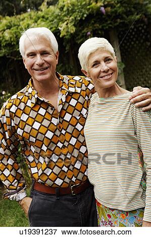 Portrait of a mature man and a senior woman smiling View Large Photo Image Stock Photo - Portrait of a mature man and a senior woman smiling. Fotosearch