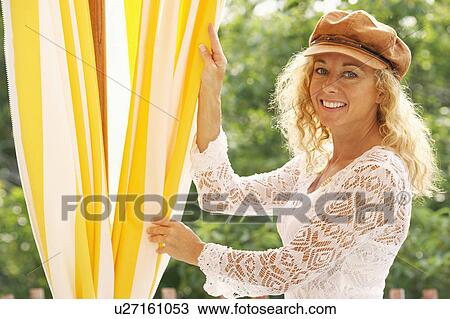 Portrait of a mature woman smiling View Large Photo Image Stock Image - Portrait of a mature woman smiling. Fotosearch