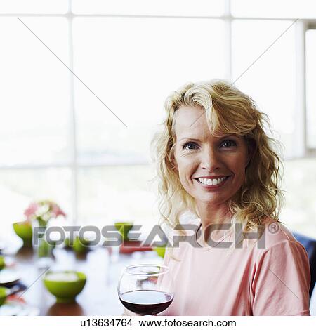 Portrait of a mid adult woman smiling View Large Photo Image Picture - Portrait of a mid adult woman smiling. Fotosearch