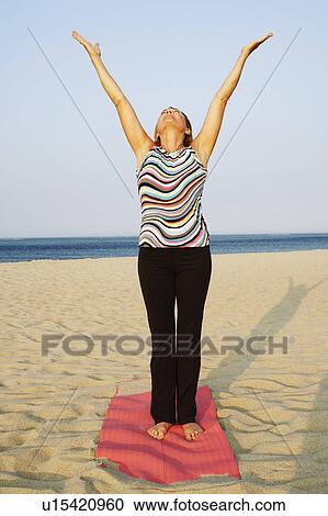Mature woman exercising on the beach View Large Photo Image Stock Image - Mature woman exercising on the beach. Fotosearch