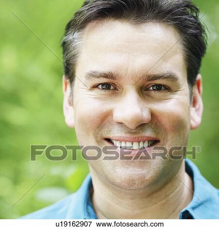 Close-up of a mature man smiling View Large Photo Image Stock Photo - Close-up of a mature man smiling. Fotosearch