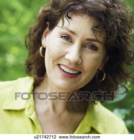 Stock Image - Close-up of a mature woman smiling. Fotosearch