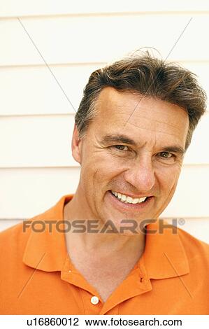 Portrait of a mature man smiling View Large Photo Image Stock Image - Portrait of a mature man smiling. Fotosearch