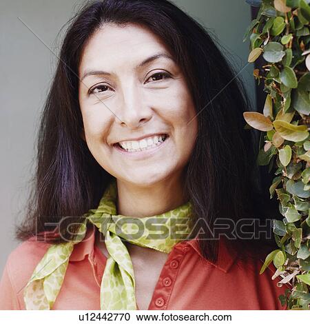 Portrait of a mature woman smiling View Large Photo Image Stock Image - Portrait of a mature woman smiling. Fotosearch