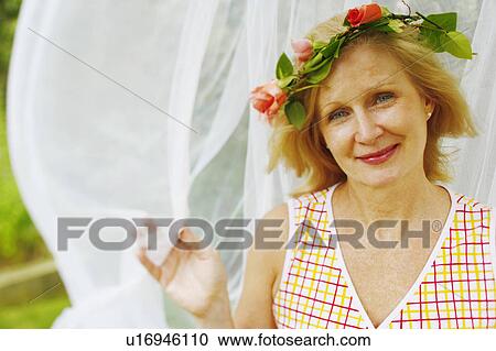 Portrait of a mature woman smiling View Large Photo Image Stock Image - Portrait of a mature woman smiling. Fotosearch