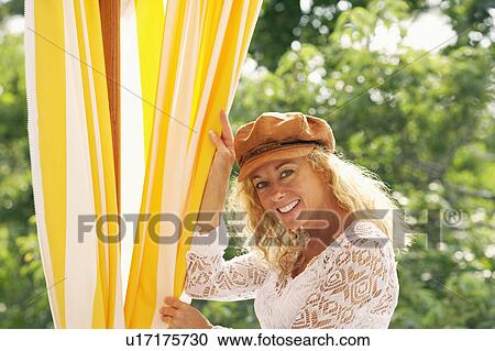 Stock Image - Portrait of a mature woman smiling. Fotosearch