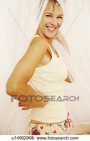 Portrait of a mature woman smiling View Large Photo Image Stock Photo - Portrait of a mature woman smiling. Fotosearch