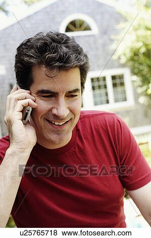 Close-up of a mature man talking on a mobile phone View Large Photo Image Stock Photo - Close-up of a mature man talking on a mobile phone. Fotosearch