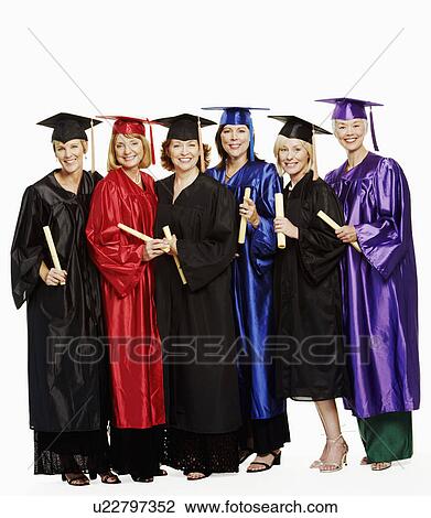 Portrait of a group of mature women wearing graduation gowns and standing together View Large Photo Image Stock Image - Portrait of a group of mature women wearing graduation gowns and standing together. Fotosearch