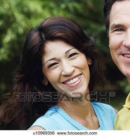 Stock Photograph - Portrait of a mature couple smiling. Fotosearch