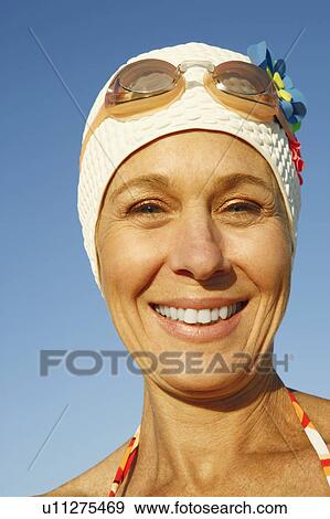 Portrait of a mature woman smiling View Large Photo Image Stock Photo - Portrait of a mature woman smiling. Fotosearch