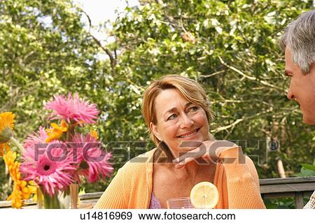 Close-up of a mature couple looking at each other and smiling View Large Photo Image Stock Photo - Close-up of a mature couple looking at each other and smiling. Fotosearch