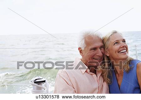 Stock Photo - Close-up of a mature couple smiling in a boat. Fotosearch