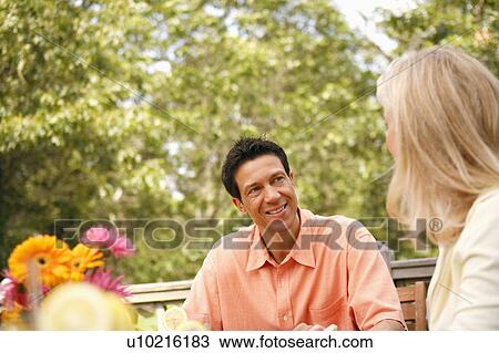 Stock Image - Mature man looking at a mature woman. Fotosearch